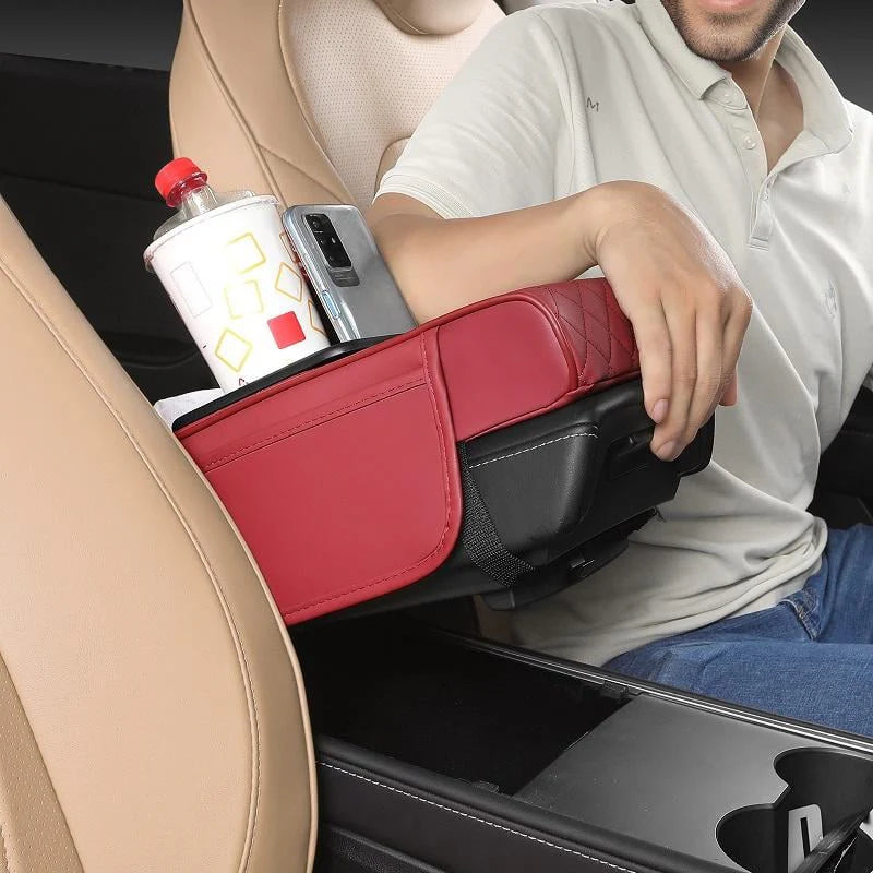 Red leather car armrest console organizer with cup holder and phone slot – side view lifestyle